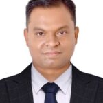 Dr. Rakesh Mittal photo wear black coat and white shirt and tie